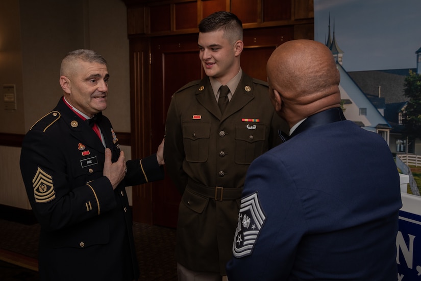 Command Sgt. Maj. David Page (left) introduces Army Spc. Garner Offutt (center) to Senior Enlisted Advisor Tony Whitehead (right) as the Kentucky National Guard's Soldier of the Year for 2023 in Lexington, Ky. on Dec. 3, 2023. Whitehead is visiting Kentucky National Guard soldiers and airmen before the holidays. (U.S. Army photo by Staff Sgt. Andrew Dickson)