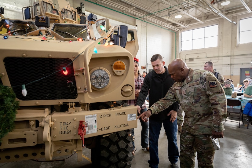 Army Sgt. 1st Class Brandon Bader (left) with the 223rd Military Police Company, 149th Manuever Enhancement Brigade describes his unit's new Mine Resistant Vehicle to National Guard Senior Enlisted Advisor Tony Whitehead at Buechel Armory in Lexington, Ky. on Dec. 4, 2022. Whitehead visited Kentucky to recognize Soldiers for their work throughout the year. (U.S. Army photo by Staff Sgt. Andrew Dickson)