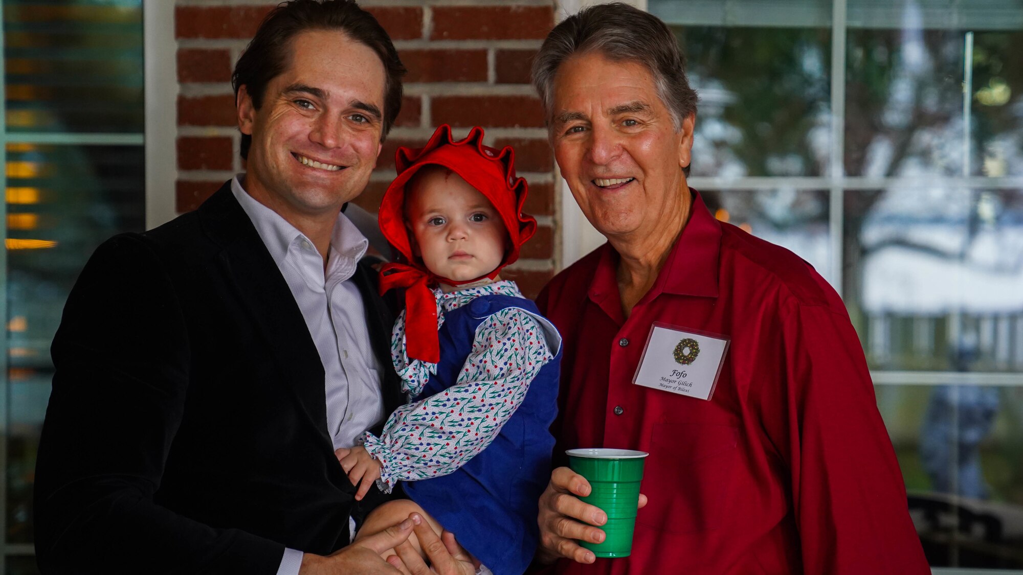 Cree Cantrell, 81st Training Wing honorary commander, and Andrew “FoFo” Gilich,  Mayor of Biloxi, pose together at the 81st Training Wing Holiday Open House at Keesler Air Force Base, Mississippi, Dec. 11, 2022.