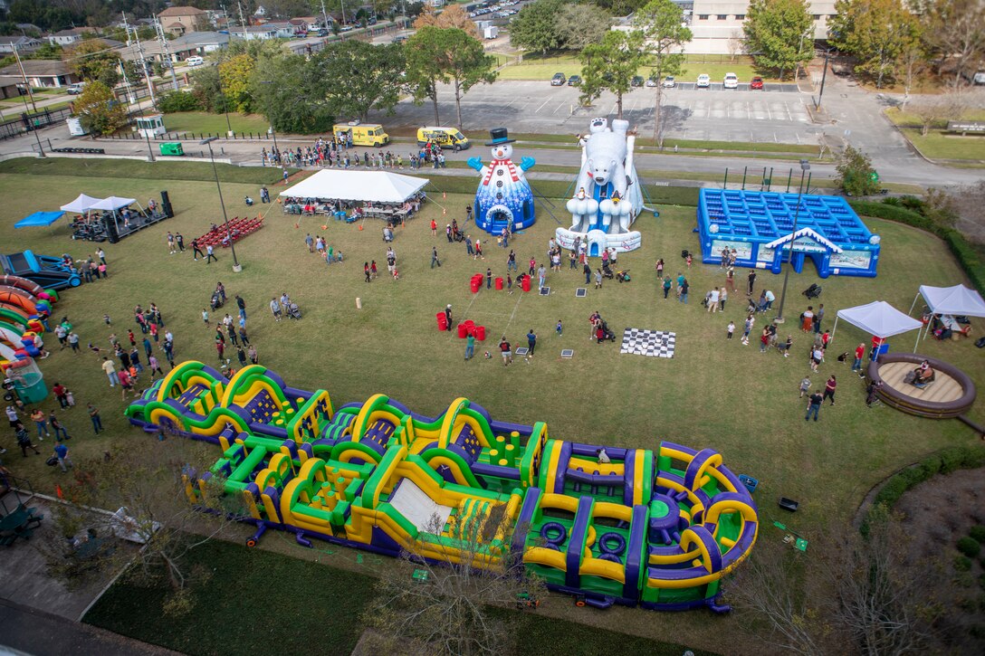Marines, sailors and their families with Marine Forces Reserve come together to celebrate the winter season during the Marine Forces Reserve Winter Social at Marine Corps Support Facility New Orleans, Dec. 10, 2022. The Winter Social is an event that brings together and thanks all of the Marines' and Sailors' families before the upcoming holidays. (U.S. Marine Corps photo by Lance Cpl. Mitchell Collyer)