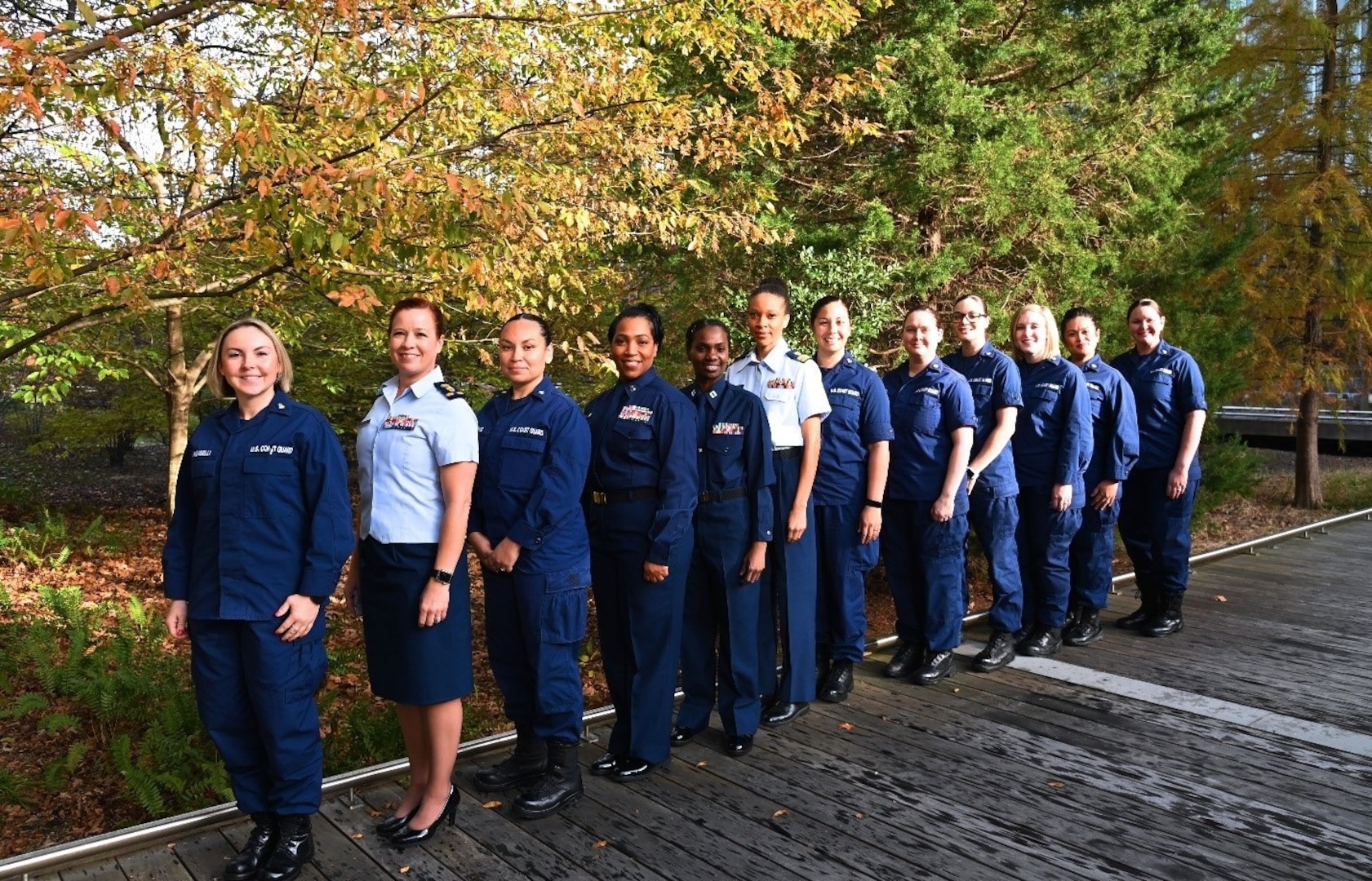 Women assigned to various directorates at Coast Guard Headquarters demonstrate different uniforms and hairstyles now available to be worn, Sep. 1, 2021. USCG photo.