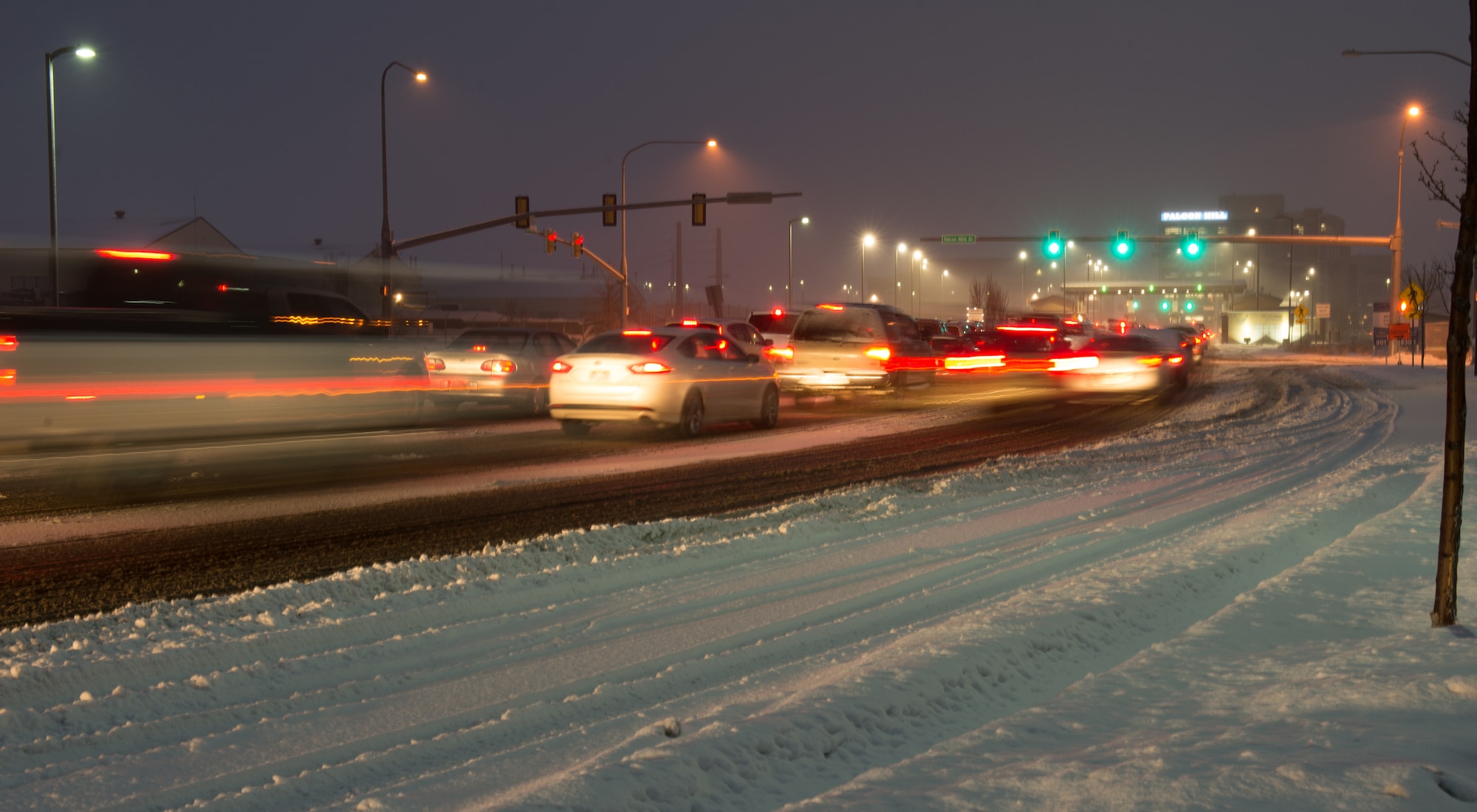 Cars lined up on a snowy road