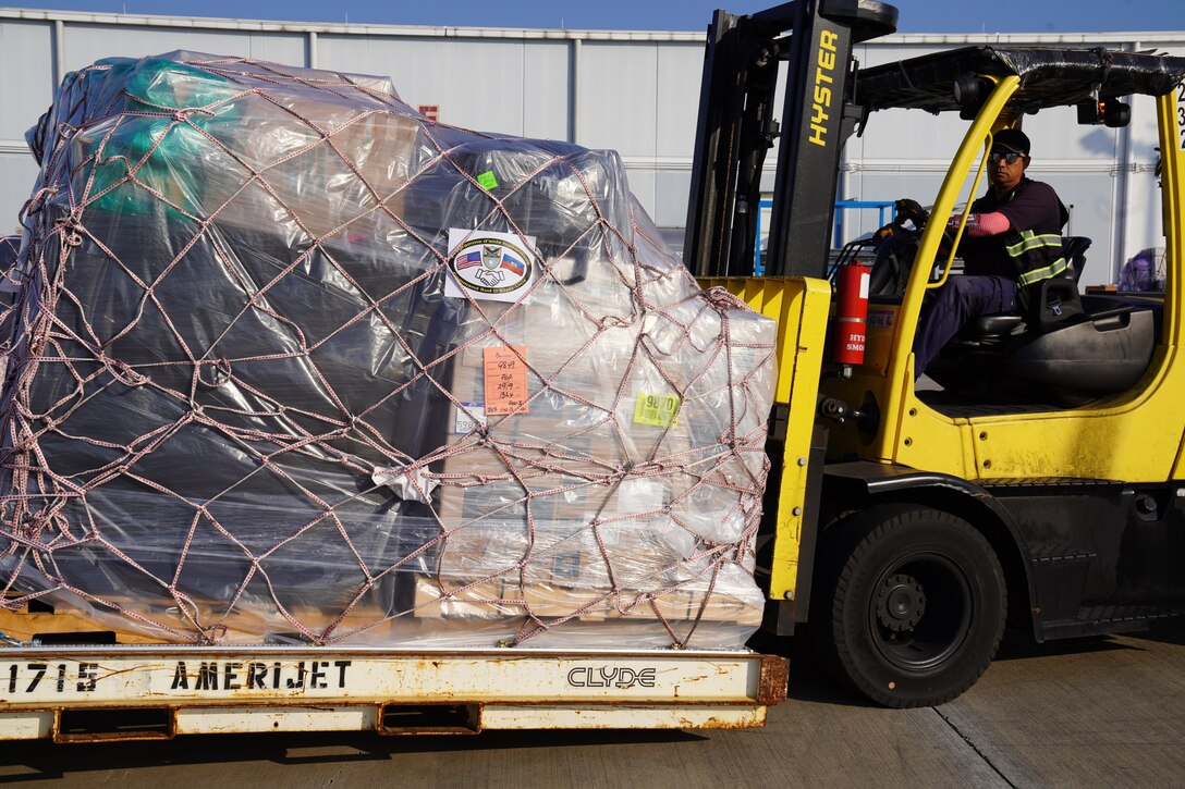 A shipment of 300,000 packets of Oral Rehydration Solution (ORS), donated by U.S. Southern Command (SOUTHCOM), is loaded onto an Amerijet cargo plane for transit to Haiti.