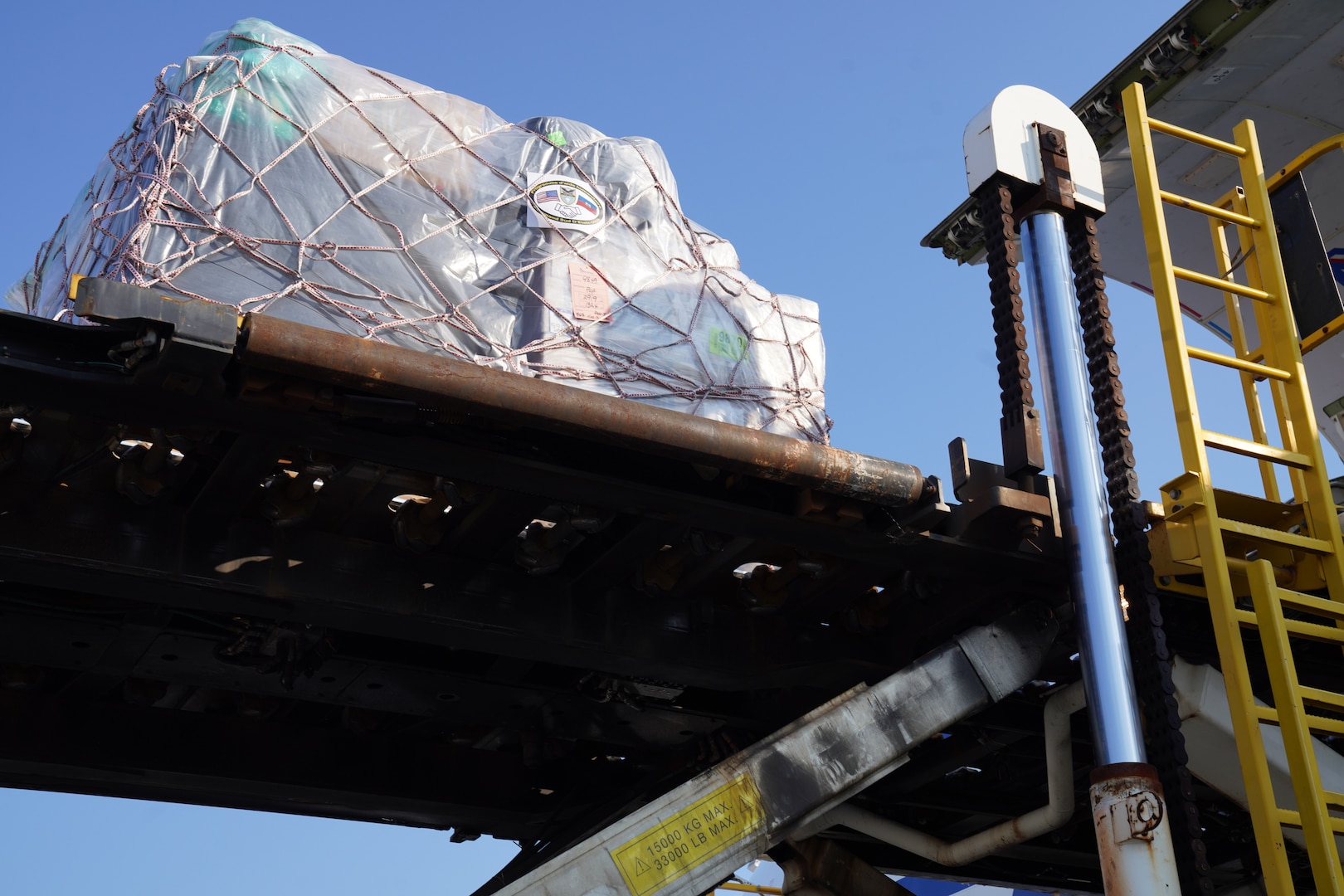 A shipment of 300,000 packets of Oral Rehydration Solution (ORS), donated by U.S. Southern Command (SOUTHCOM), is loaded onto an Amerijet cargo plane for transit to Haiti.