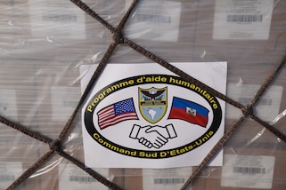 A shipment of 300,000 packets of Oral Rehydration Solution (ORS), donated by U.S. Southern Command (SOUTHCOM), is loaded onto an Amerijet cargo plane for transit to Haiti.
