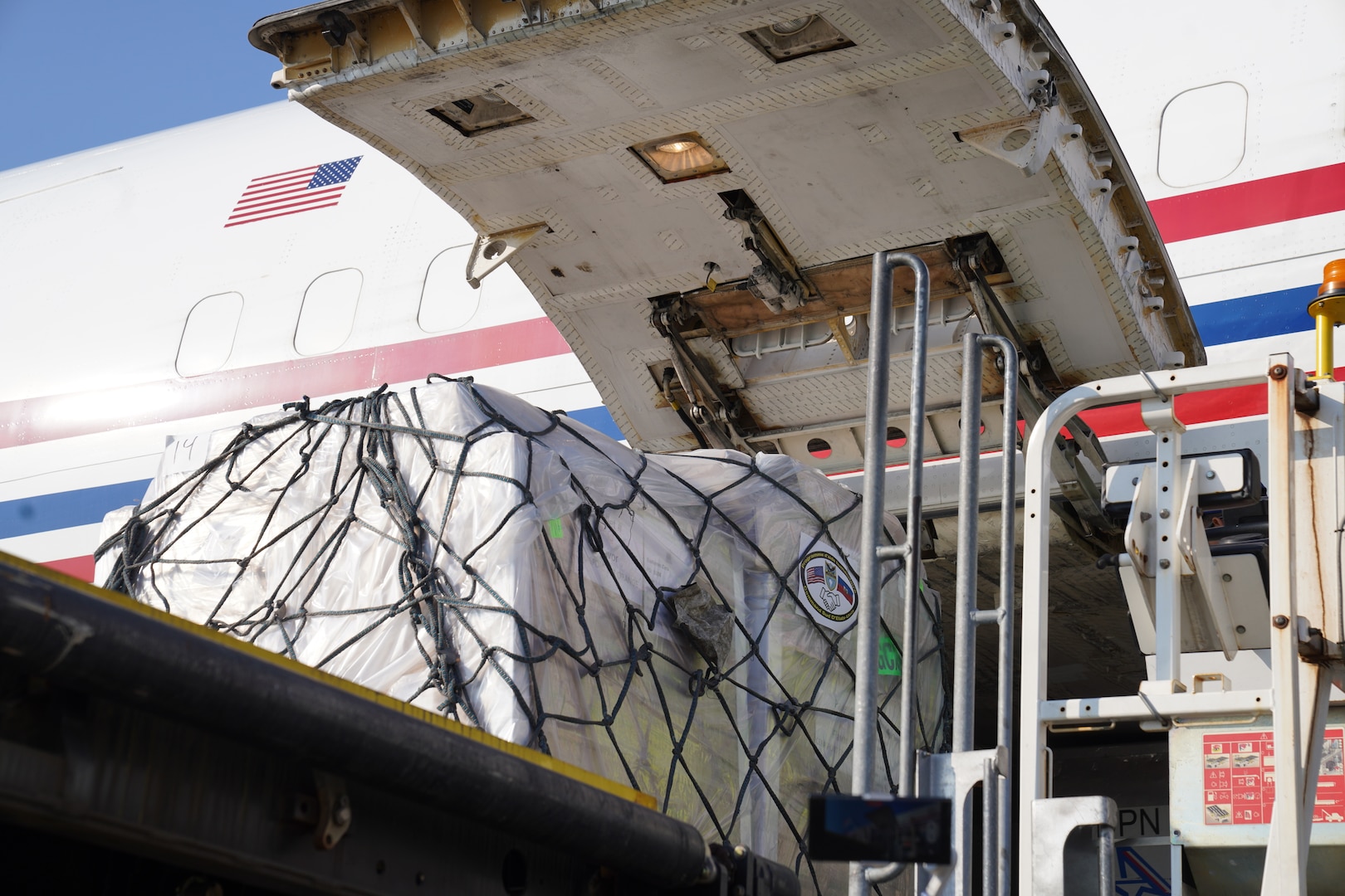 A shipment of 300,000 packets of Oral Rehydration Solution (ORS), donated by U.S. Southern Command (SOUTHCOM), is loaded onto an Amerijet cargo plane for transit to Haiti.