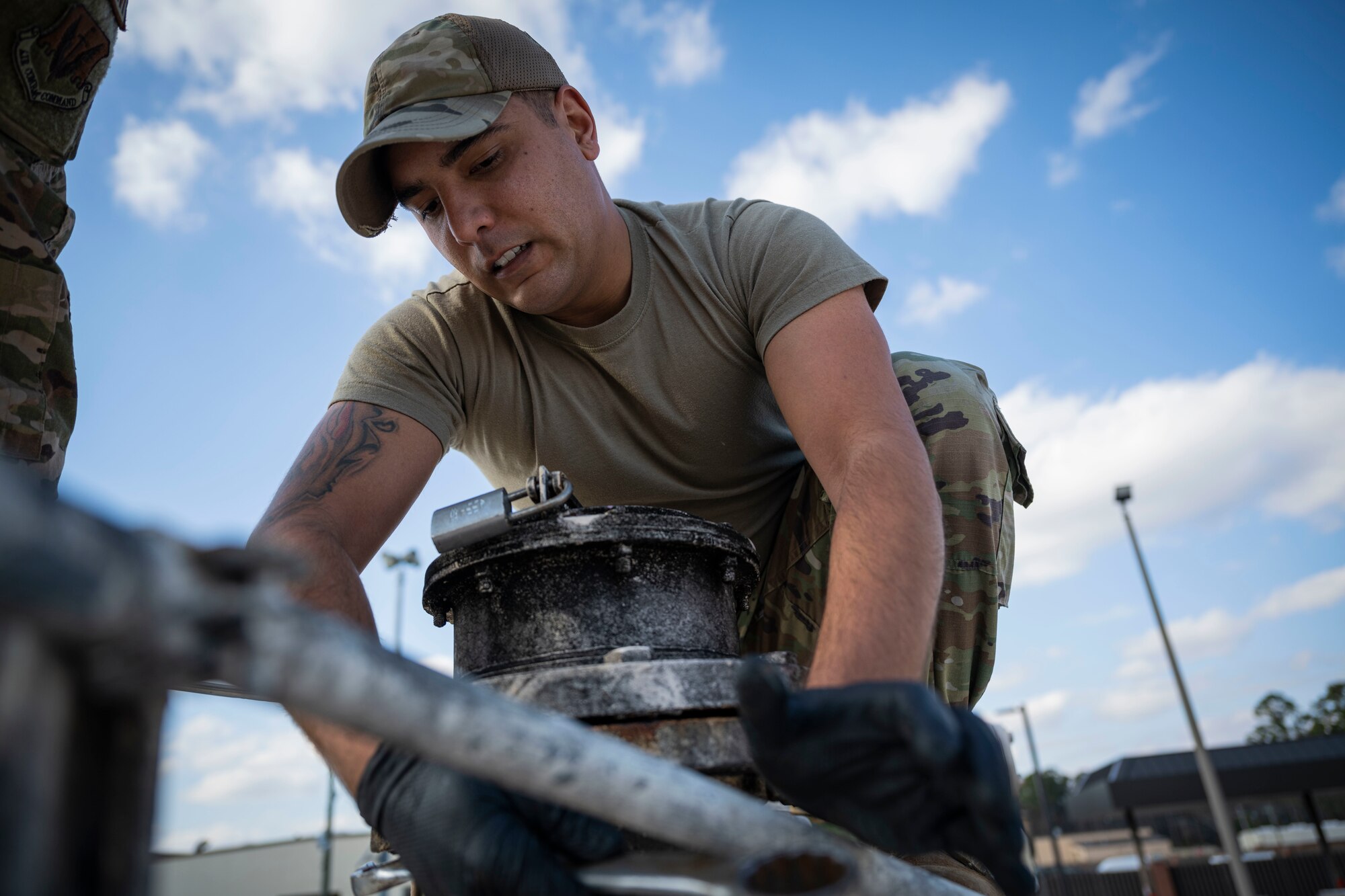 Senior Airman Justin Bellivan, 4th Civil Engineer Squadron liquid fuels maintenance technician, replaces an emergency vent on a fuel tank at Seymour Johnson Air Force Base, North Carolina, Dec. 13, 2022. Emergency vents open up to help prevent excess pressure build up in fuel tanks.