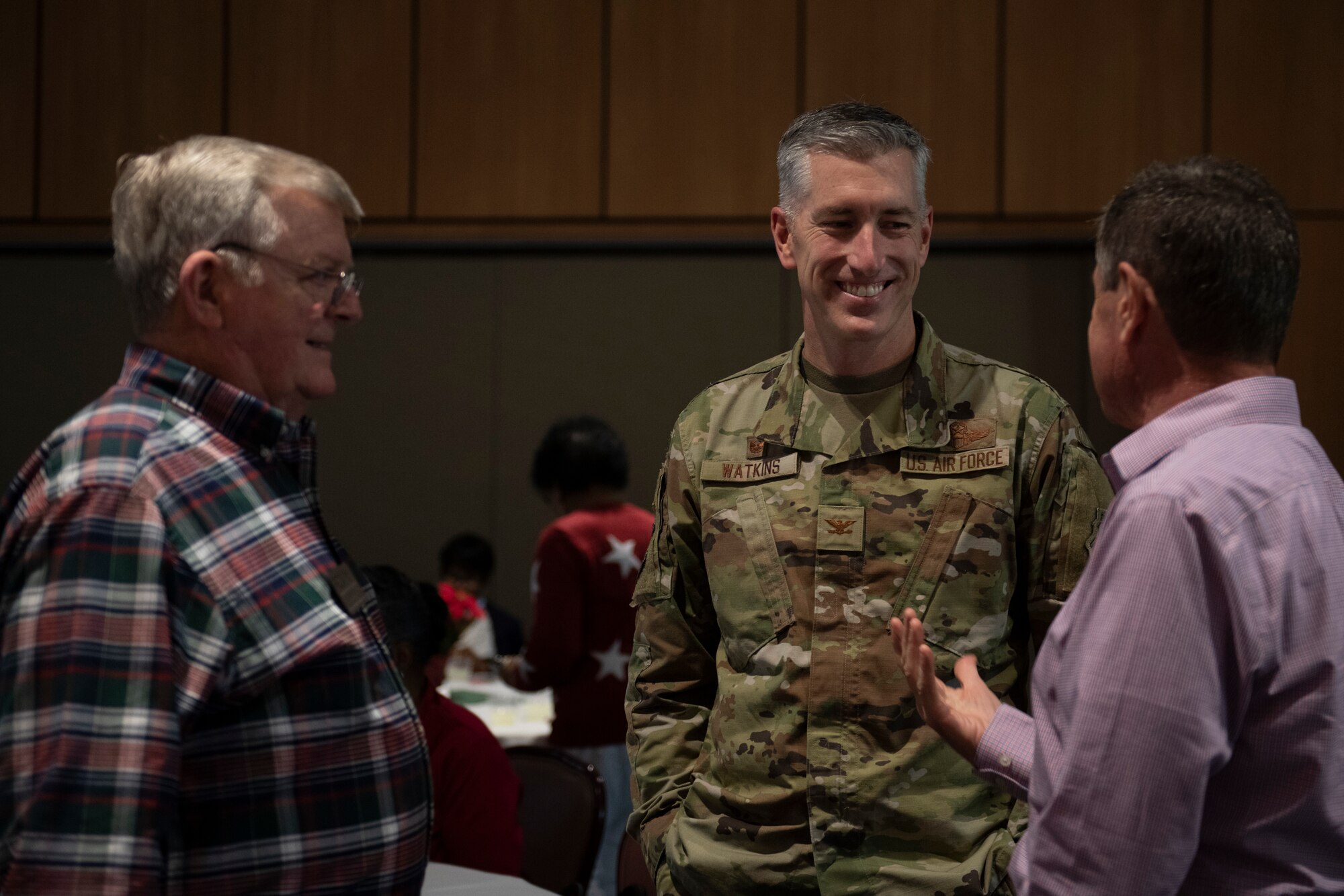 U.S. Air Force Col. George Watkins, 325th Fighter Wing commander, talks to senior citizen veterans at Tyndall Air Force Base, Florida, Dec. 9, 2022.