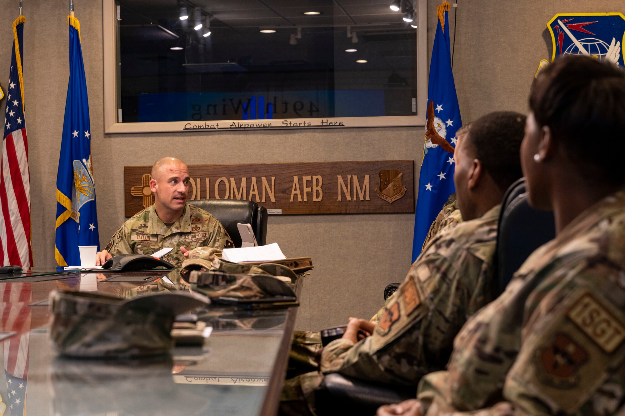 U.S. Air Force Chief Master Sgt. Ryan Taylor, Air Education and Training Command first sergeant, speaks with 49th Wing first sergeants about career field changes during a visit to Holloman Air Force Base, New Mexico, Dec. 8, 2022. Taylor met with 49th Wing first sergeants and other leadership to discuss the wing mission, and morale and welfare of Team Holloman Airmen. (U.S. Air Force photo by Airman 1st Class Nicholas Paczkowski)