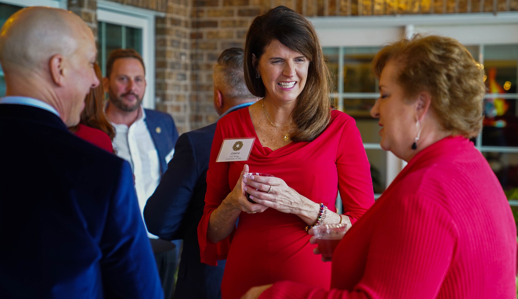 U.S. Air Force Col. Laura King, 81st Training Group commander, talks with other guests of the 81st Training Wing Holiday Open House at Keesler Air Force Base, Mississippi, Dec. 11, 2022.