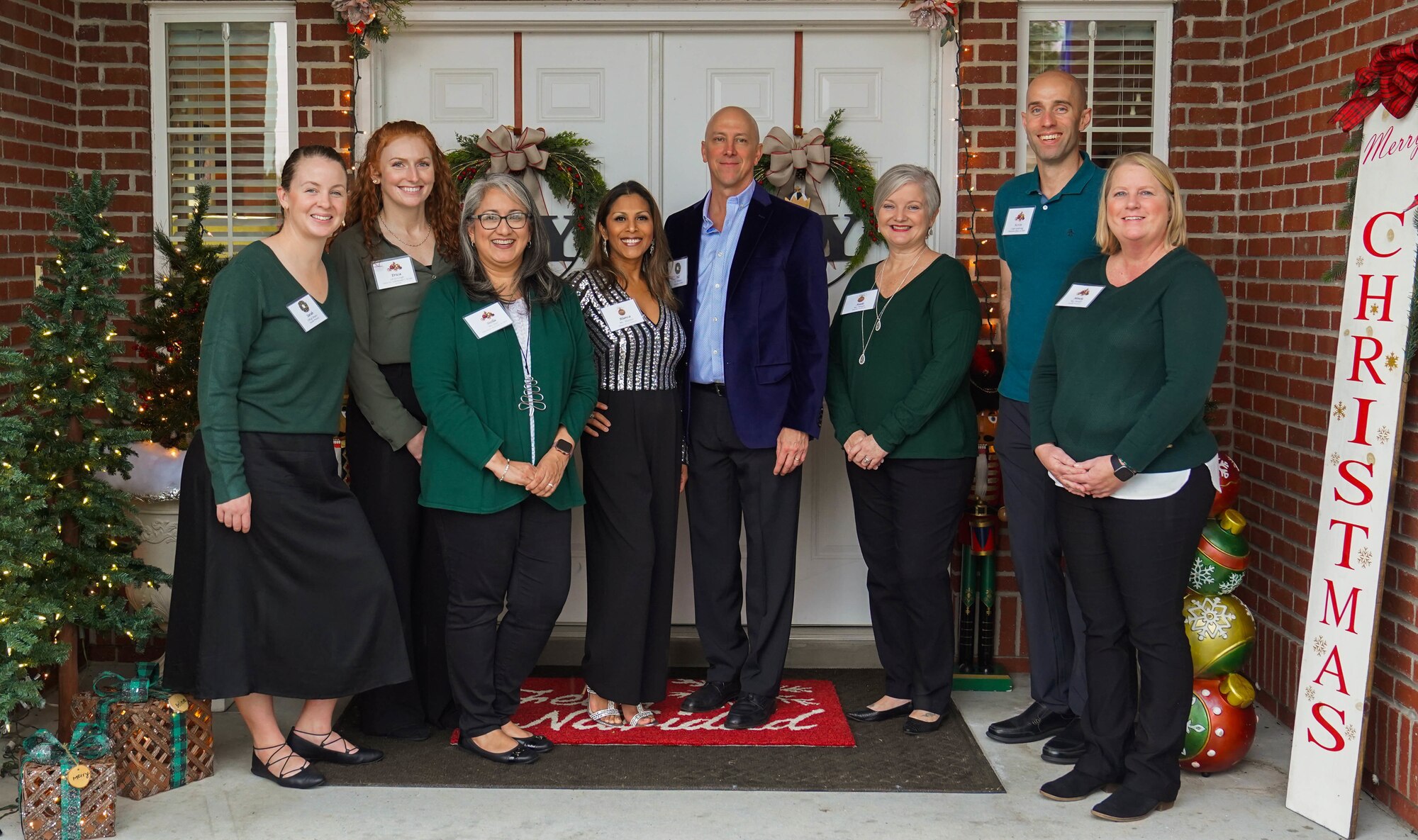 U.S. Air Force Col. William Hunter, 81st Training Wing commander, poses with his wife, Blanca Hunter, and members of his staff at the 81st TRW Holiday Open House at Keesler Air Force Base, Mississippi, Dec. 11, 2022.