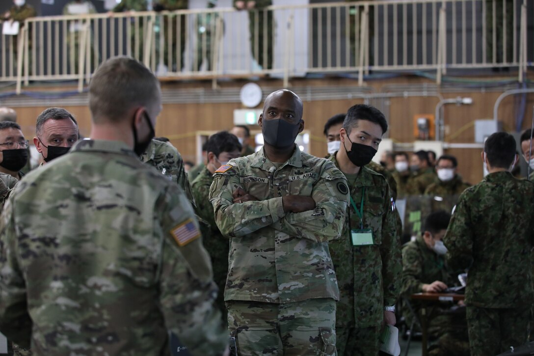 Commanding General of U.S. Army I Corps, Lt. Gen. Xavier Brunson, is briefed by a Soldier assigned to the U.S. Army 11th Airborne Division, Dec. 8, 2022, at Camp Higashi-Chitose, Japan.  "America’s First Corps" has participated in Exercise Yama Sakura for 27 years. This year, I Corps provides command and control to the 7th Infantry Division, 11th Airborne Division as well as the 3rd Marine Division. (U.S. Army National Guard photo by Sgt. Randall. E. Corpuz)