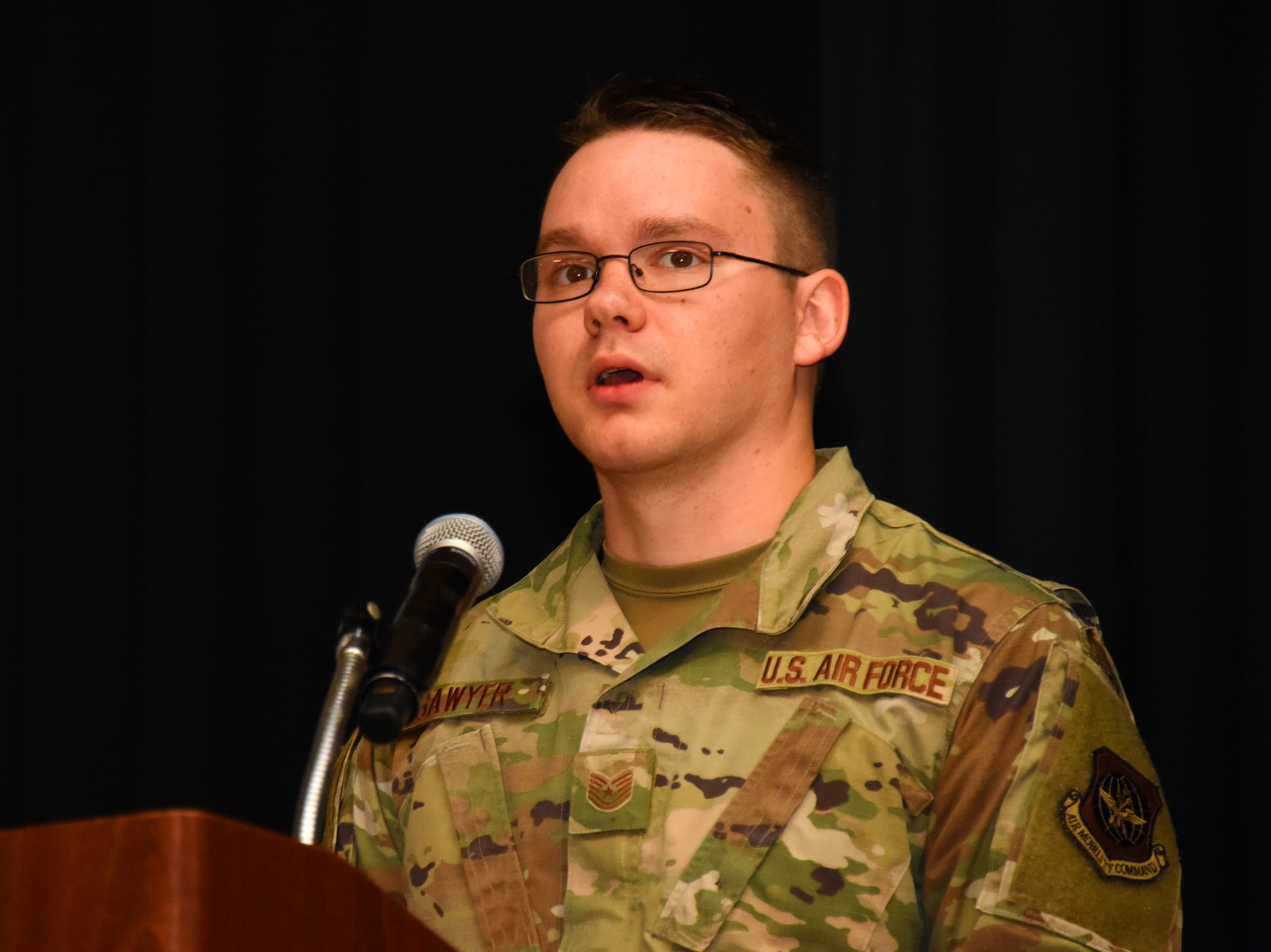 U.S. Air Force Tech Sgt. Shane Sawyer, 305th Maintenance Group Quality Assurance Inspector, talks to Airmen at the symposium.