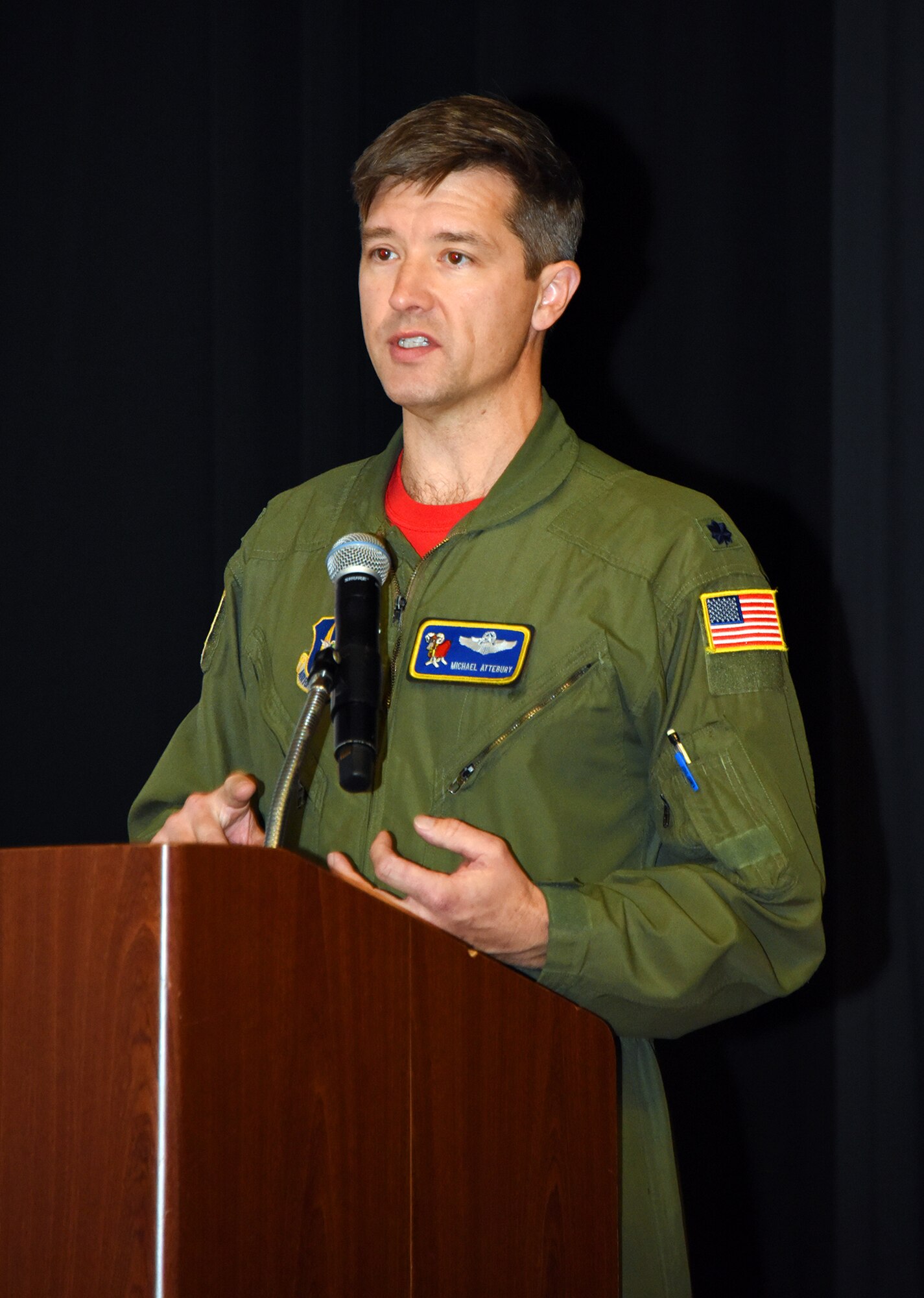 U.S. Air Force Lt. Col. Michael Attebury, 514th Air Mobility Wing flight safety officer, speaks to Airmen at the symposium.