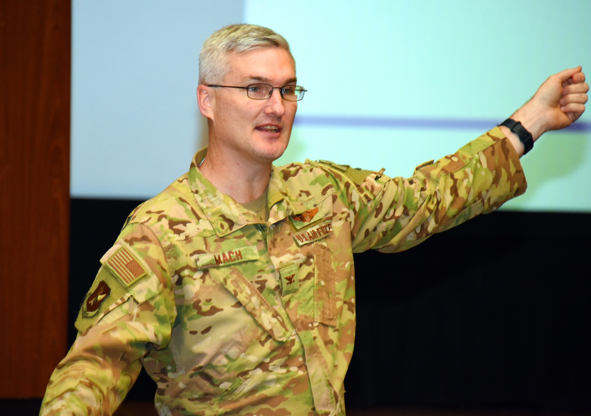 U.S. Air Force Col. Timothy Mach, 305th Air Mobility Wing vice commander, talks to Airmen at the symposium.