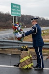 U.S. Staff Sgt. Andrew Bartley, 167th Honor Guard member, places a wreath during the bridge dedication ceremony, Dec. 3, 2022. The Tabler Station Overpass was renamed the U.S. Air Force Staff Sgt. Logan A. Young Memorial Bridge. Young was a firefighter for the 167th Airlift Wing and lost his life while fighting a fire Dec. 27, 2020.