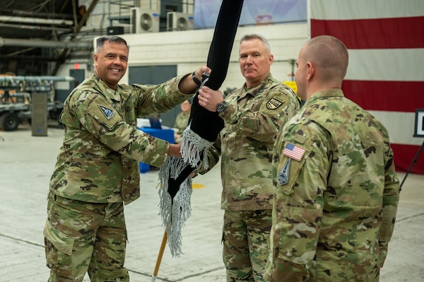 U.S. Space Force Brig. Gen. Anthony Mastalir, U.S. Space Forces Indo-Pacific Command commander, passes the newly activated U.S. Space Forces Korea’s guidon to Gen. Paul LaCamera, United Nations Command / Combined Forces Command / United States Forces Korea commander, during the unit’s activation ceremony at Osan Air Base, Republic of Korea, Dec. 14, 2022. The newly activated USSFK will be tasked with coordinating space operations and services such as missile warning, position navigation and timing, and satellite communications within the region.