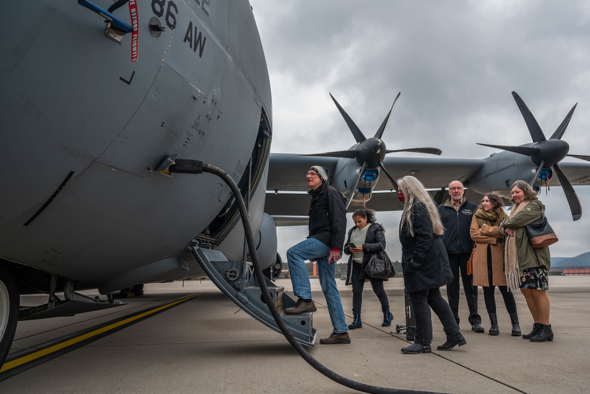 Members of Team Ramstein and their guests tour a C-130J Super Hercules aircraft following a length of service ceremony at Ramstein Air Base, Germany, Dec. 8, 2022.