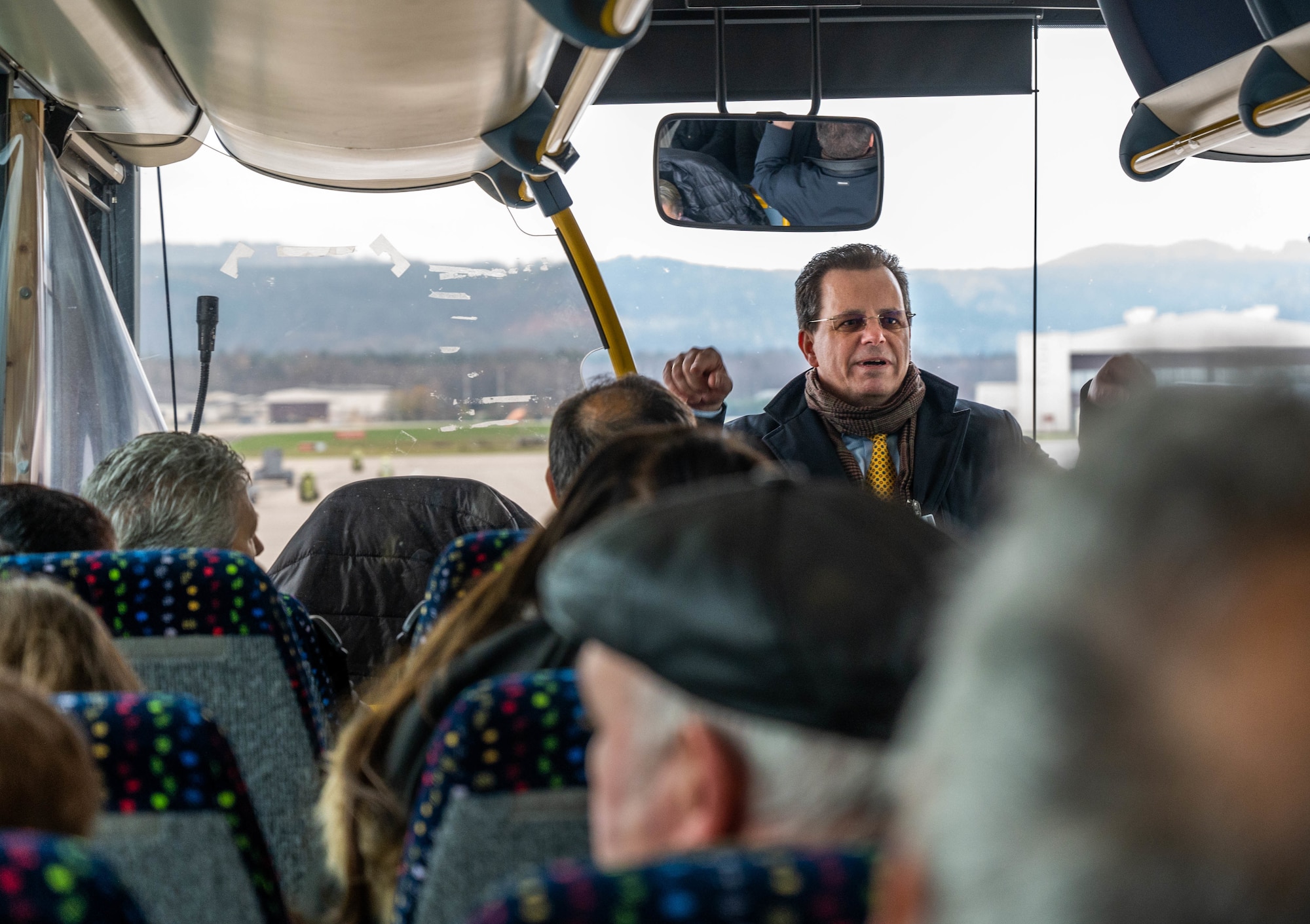 Michael Gannon, 86th Airlift Wing Host Nation advisor, gives a base tour to U.S. and German civilians and their guests after a length of service ceremony at Ramstein Air Base, Germany, Dec. 8, 2022.
