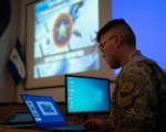 Sgt. Adam Dorian Wong, a threat researcher with 136th Cybersecurity Unit, presents new topics of interest including artificial intelligence and vulnerability identification to the Salvadoran cybersecurity unit in San Salvador, El Salvador, Dec. 7, 2022. The new material was targeted toward the Salvadoran team’s goals and vision.
