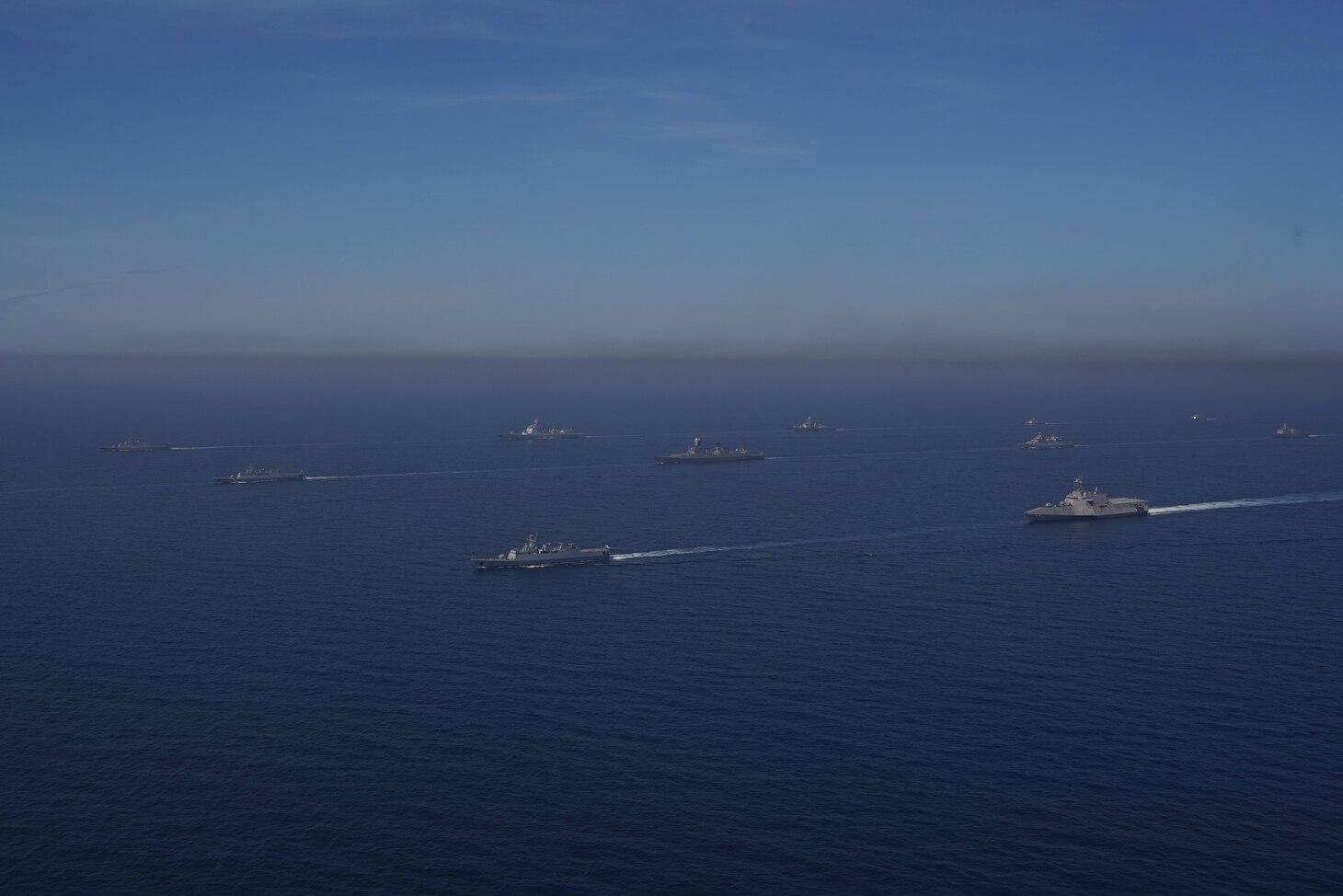 WATERS OFF COX’S BAZAR, Bangladesh (Dec. 9, 2022) – The Independence-variant littoral combat ship USS Oakland (LCS 24) sails in formation with ships from nations participating in International Fleet Review (IFR) 2022 in the waters off Cox’s Bazar, Bangladesh Dec. 9. Oakland is participating in IFR 2022 organized by the Bangladesh Navy, which intends to promote good will, strengthen cooperation and serve as an ideal platform for world’s navies to showcase their prowess, naval diplomacy, and cooperation in a global arena. (Bangladesh Navy courtesy photo)