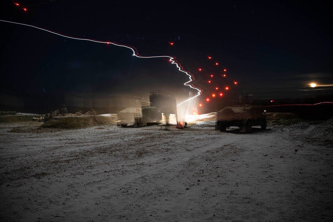 Soldiers conduct live-fire training at night.