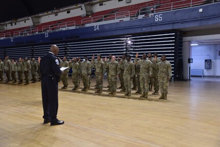 District of Columbia National Guard
members are sworn in by Washington Metropolitan Police Dept. (MPD) officer, Lieutenant Jefferey Parker, in preparation to support the Africa Leaders Summit this week.