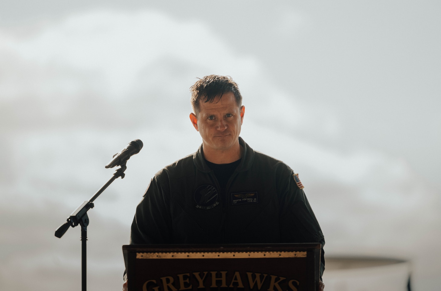 Man standing at podium,