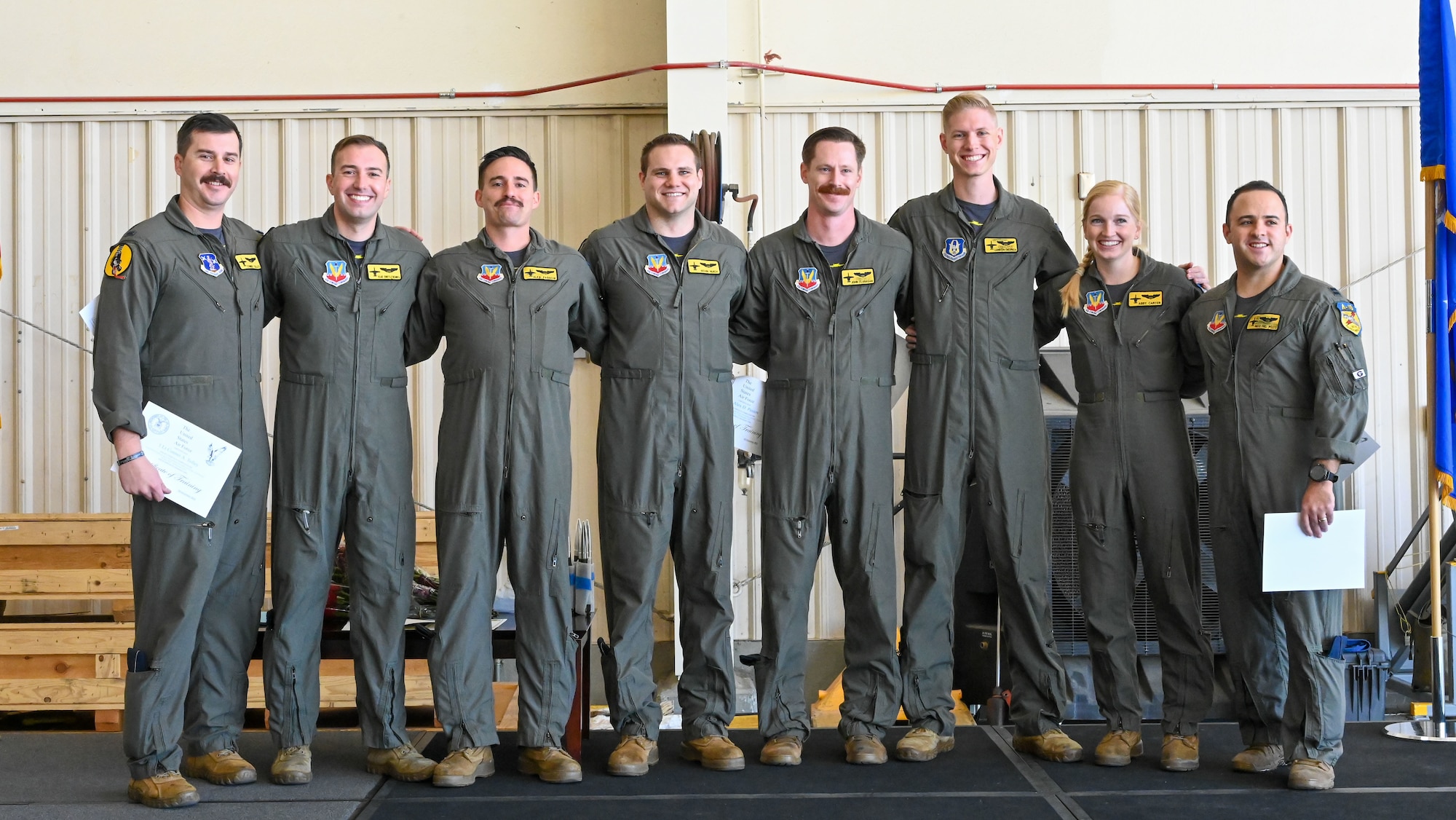 Pictured above is a group of Airmen posing for a photo.