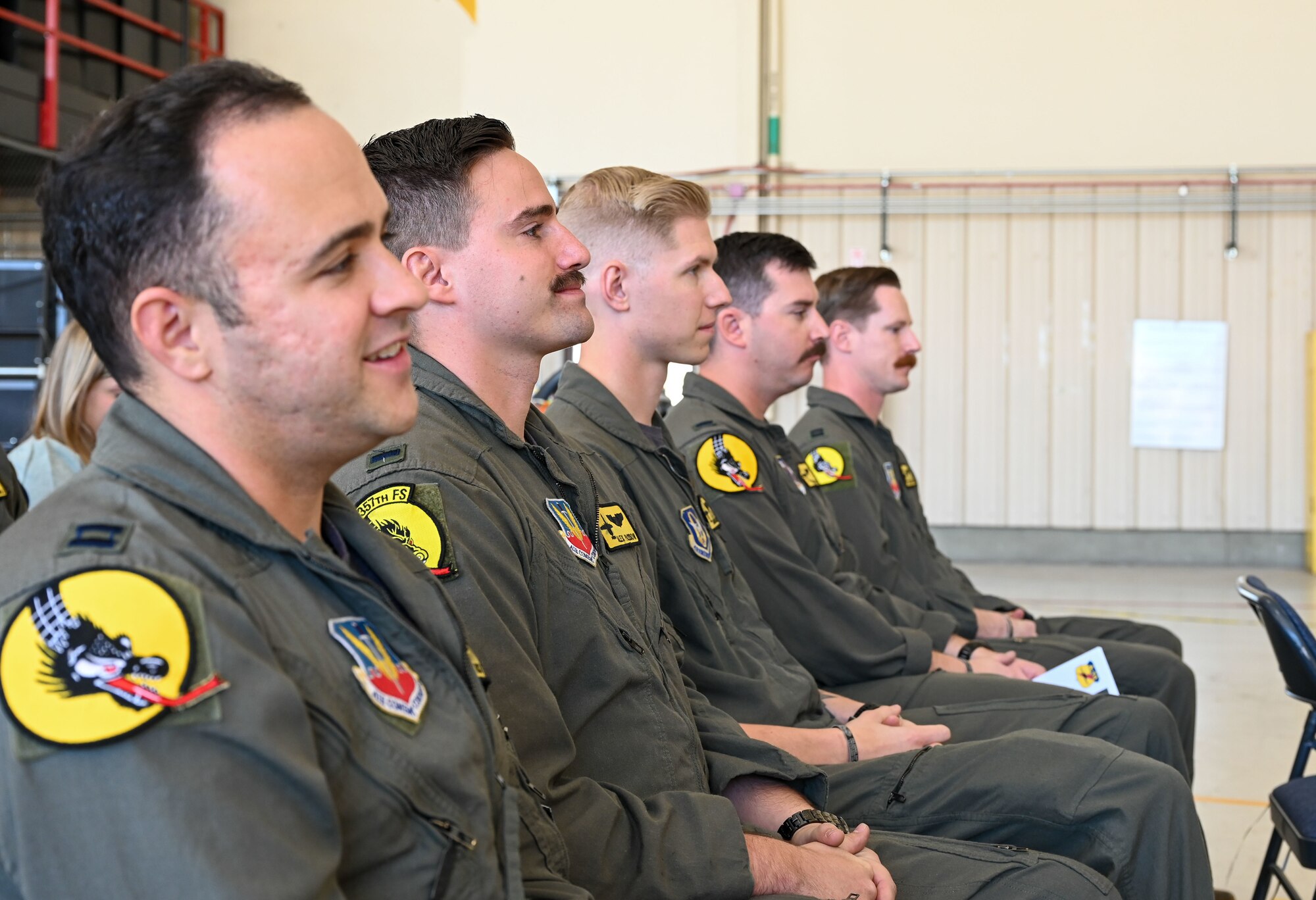 Pictured above is a group of Airmen seated during a ceremony.