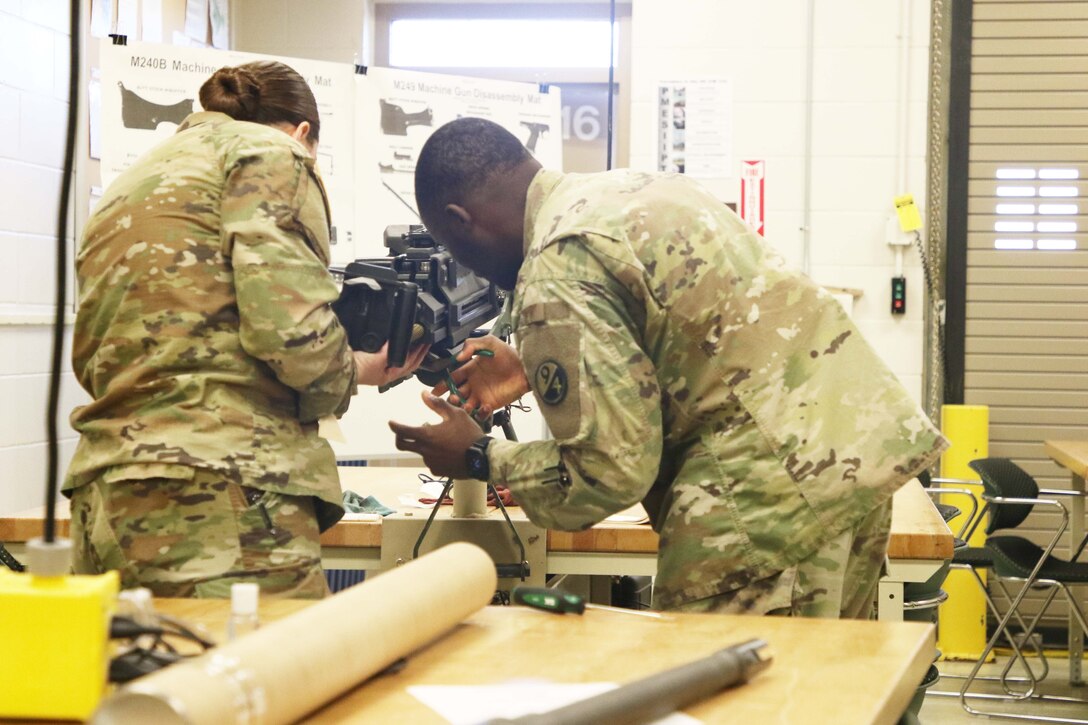 Sgt. 1st Class Jerry Fumba assist Spc. Emma Burbridge with reassembling the Mark 19.
During the 7-day unit armorer course at RTSM-Devens, 19 students learned how to disassemble reassemble and perform a functions check on 7 different weapons systems.