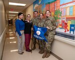 The National Capital Consortium (NCC) Pediatrics Residency Program at Walter Reed National Military Medical Center (WRNMMC) members pose for a group photo at WRNMMC in Bethesda, Maryland, Dec. 13, 2022. NCC Pediatrics Residency Program at WRNMMC were being recognized for the continued superior performance of their residency training program.