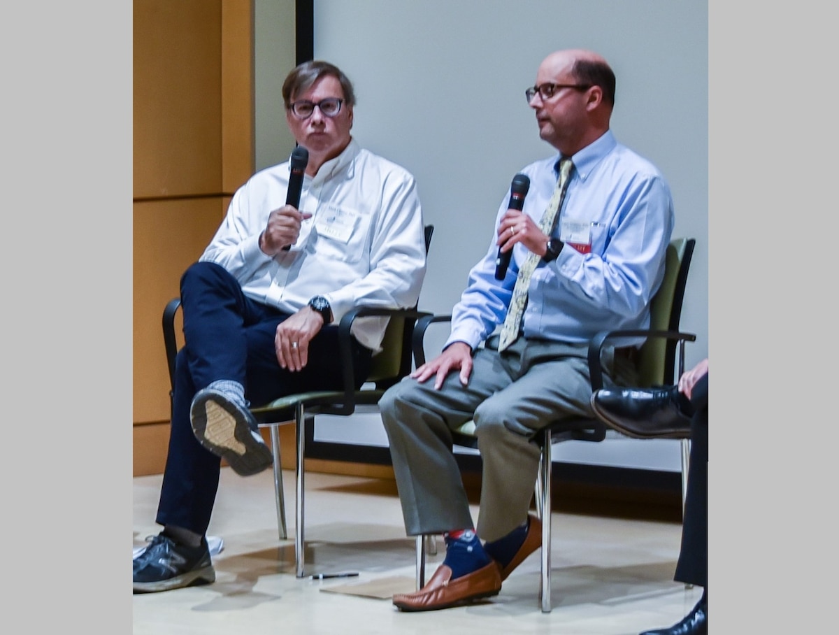 Case Western Reserve University Nutrition Professor and BioSIS founder Dr. Mark Chance, left, discusses advancements in wearable biomolecular sensor technology with Air Force Research Laboratory, or AFRL, Senior Materials Engineer and Technical Lead Dr. Lawrence Drummy, right, Aug. 18, 2022, during the Biomedical Sciences for the Department of Defense Mission Symposium at Case Western Reserve University in Cleveland, Ohio. AFRL partnered with the Nano Bio-Materials Consortium and Case Western Reserve University to create wearable biomolecular sensors that measure biomarkers in Airmen and Guardians, and has transferred that technology to Sensate Biosystems, a spinoff company of Case Western Reserve University. (Courtesy photo)