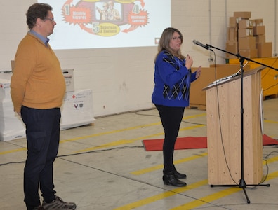 Jenny Grasser, right, safety specialist at the U.S. Army Medical Materiel Center-Europe, speaks during a safety stand down event Nov. 18 at Kaiserslautern Army Depot, Germany. Also pictured is Holger Ebeler.