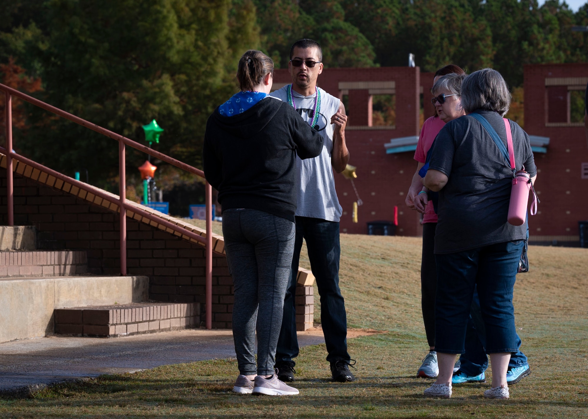 Members of Sumter Survivors walking group accept donation at Out of the Darkness walk for suicide prevention.