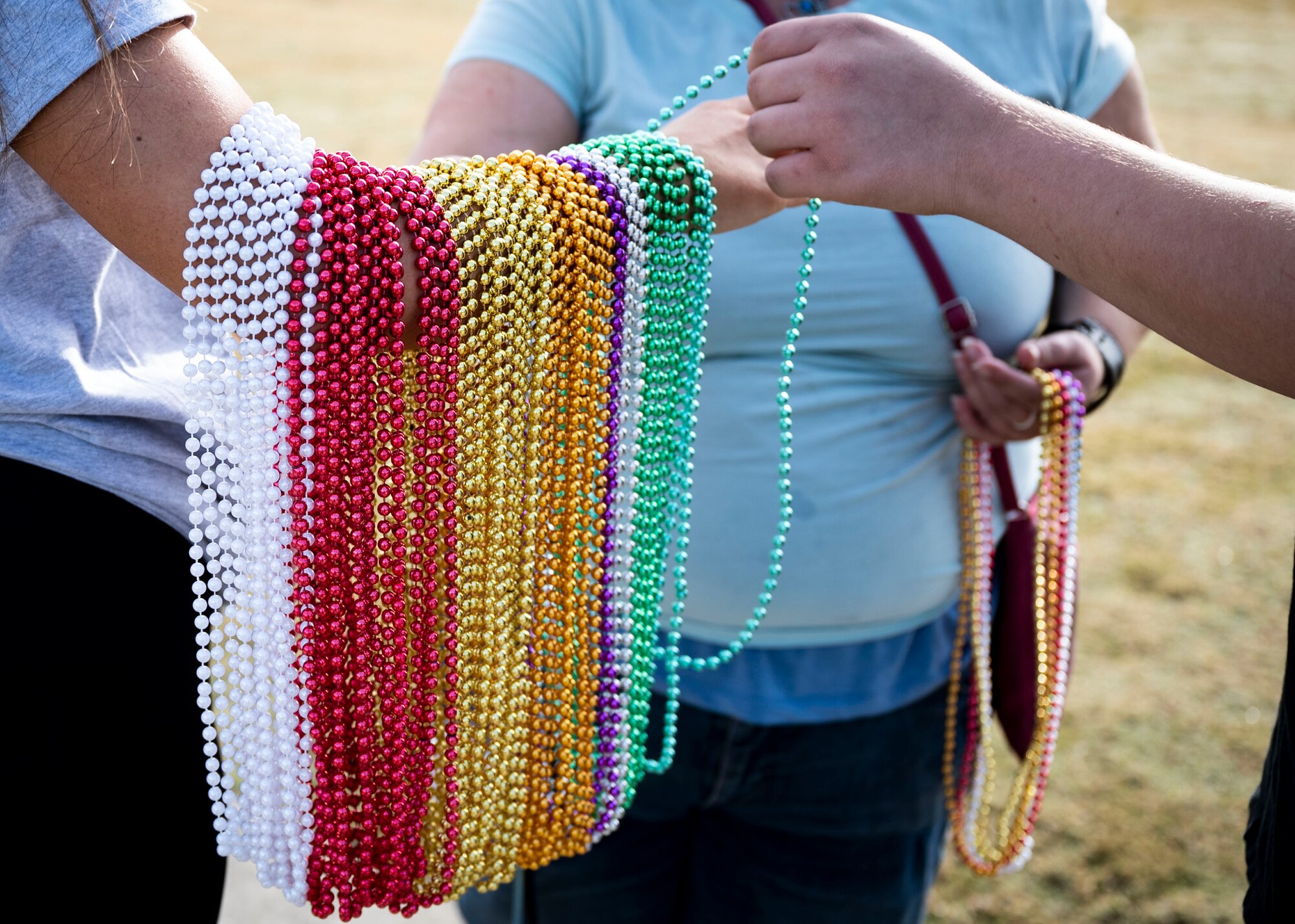 AFSP volunteer hands out colored beads at Suicide Prevention walk