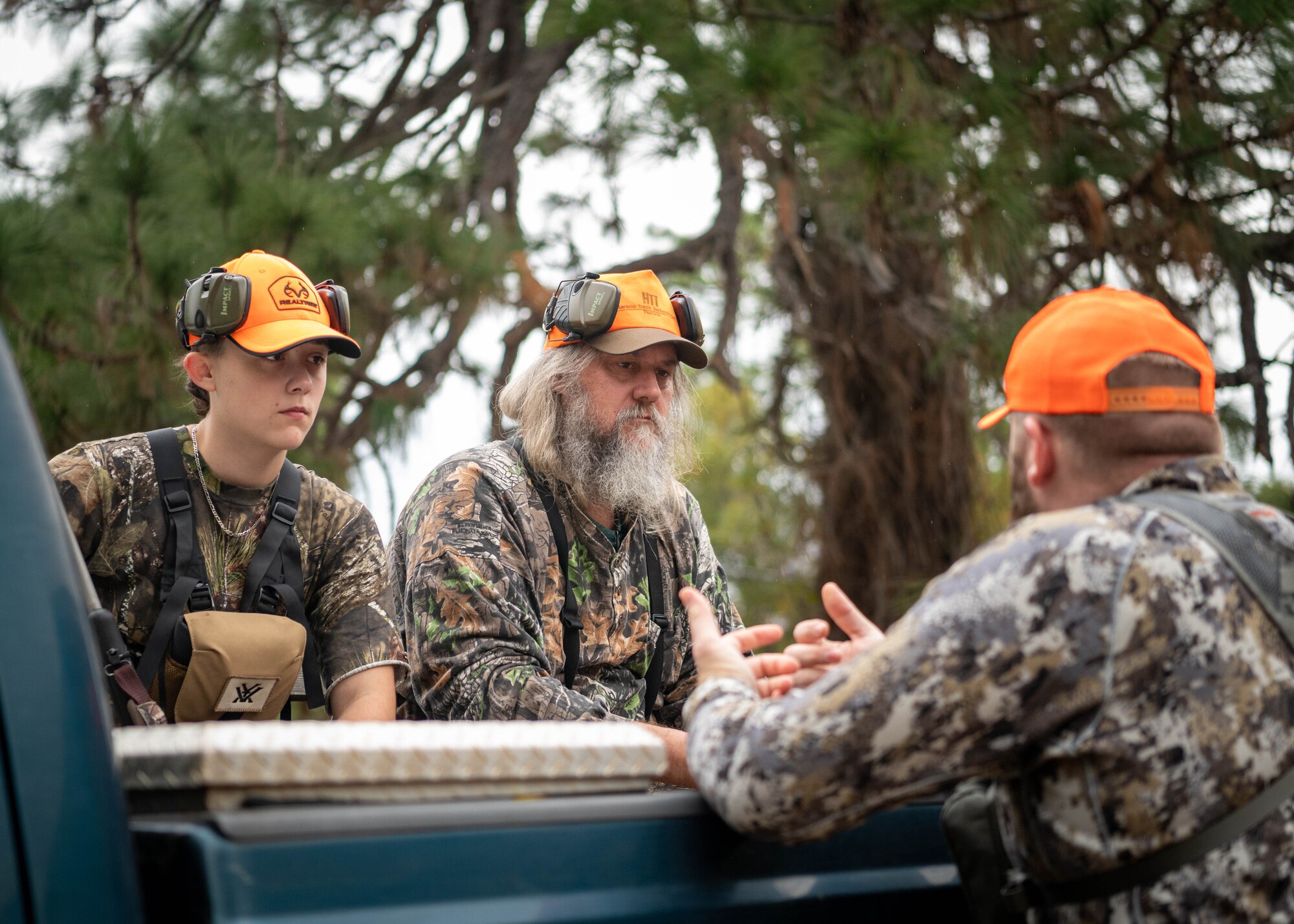 A huntmaster gives instruction to participants in a youth hunting event.