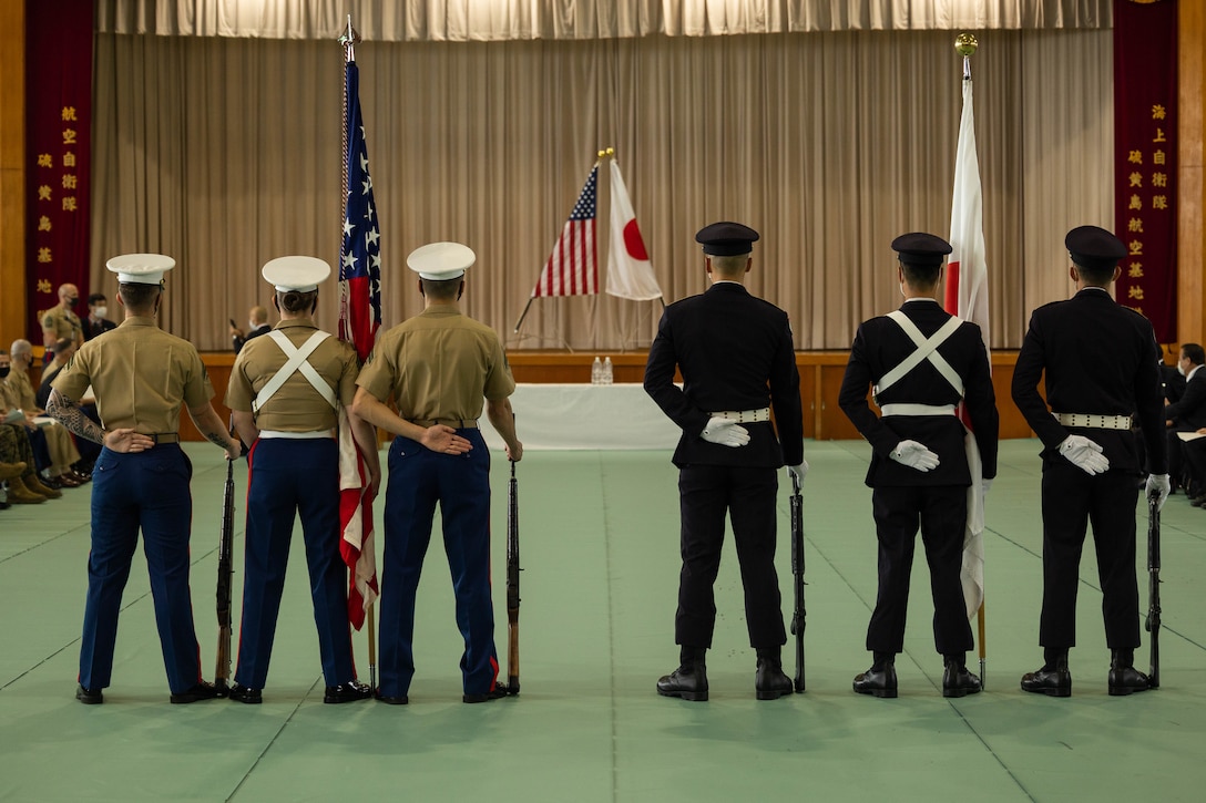 The U.S. Marine Corps III Marine Expeditionary Force Support Battalion color guard and Japan Ground Self-Defense Force color guard members participate in the 2022 Reunion of Honor on Iwo To, Japan, Dec. 10, 2022. The Reunion of Honor is an annual ceremony that commemorates the sacrifices made by both Japanese and American service members who fought during World War II on Iwo To. (U.S. Marine Corps photo by Lance Cpl. Paley Fenner)