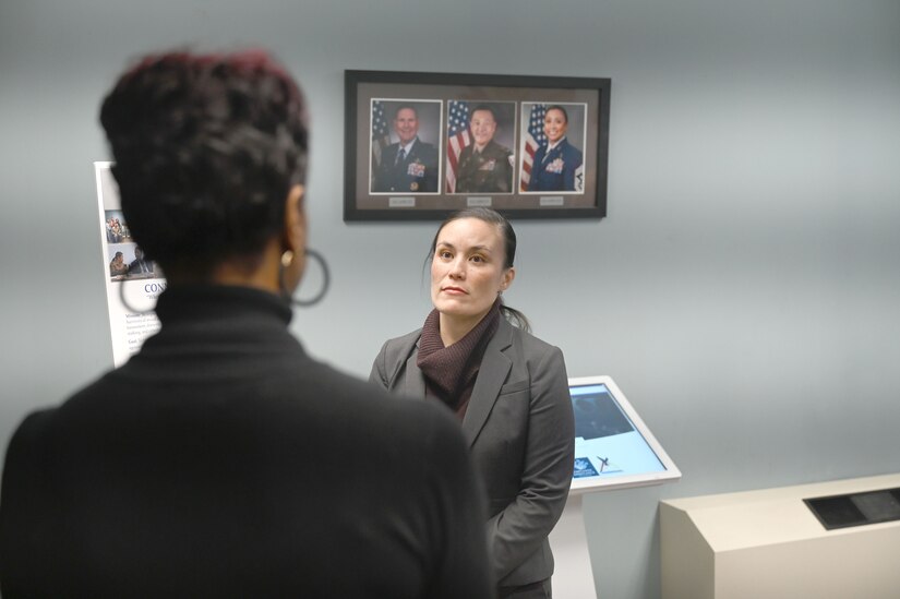 Under Secretary of the Air Force Gina Ortiz Jones coins civilian worker.