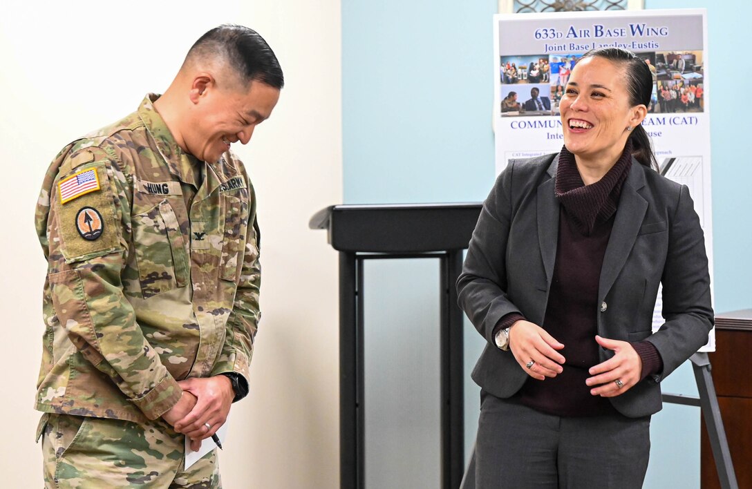 Under Secretary of the Air Force Gina Ortiz Jones laughs with Col Harry Hung.