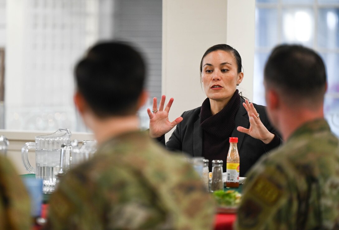 Under Secretary of the Air Force Gina Ortiz Jones meets with Airmen during a luncheon.