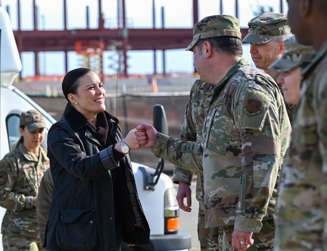 Under Secretary of the Air Force Gina Ortiz Jones greets base leadership