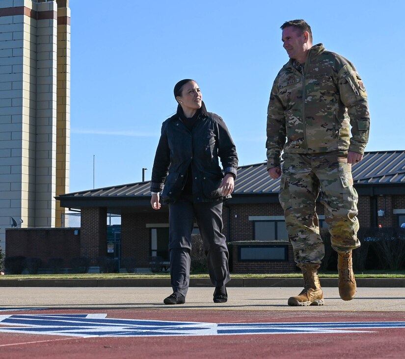 Under Secretary of the Air Force Gina Ortiz Jones walks on the flightline with Col. Gregory Beaulieu.