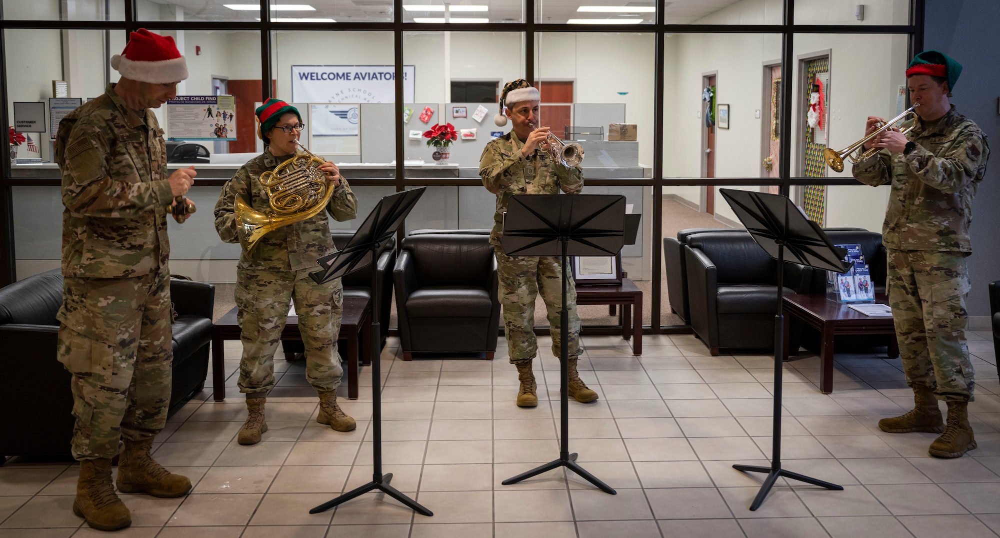 Members of the U.S. Air Force Heritage of America band brass quartet perform for the Wayne School of Technical Arts at Seymour Johnson Air Force Base, North Carolina, Dec. 14, 2022.  The Heritage of America Band’s goal is to inspire diverse audiences by displaying the highest level of professionalism while epitomizing military precision and excellence.