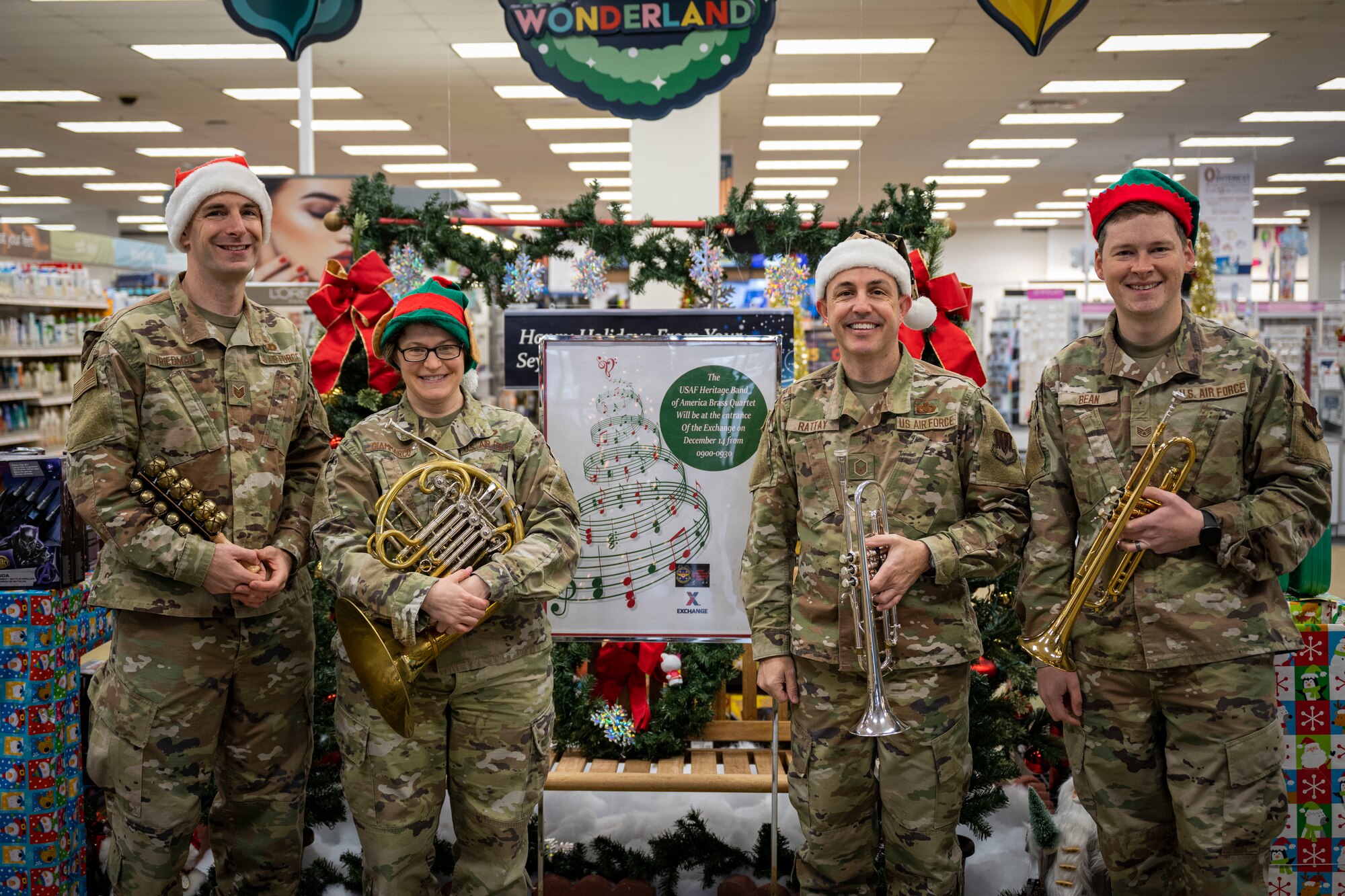 Airmen assigned to the U.S. Air Force Heritage of America Band brass quartet pose for a photo at Seymour Johnson Air Force Base, North Carolina, Dec. 14, 2022. The band played Christmas carols at various locations around base.