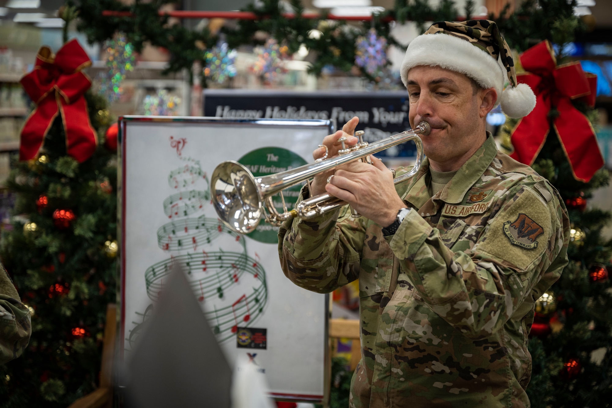 Master Sgt. Jonathan Rattay, U.S. Air Force Heritage of America Band trumpet player, performs at the Seymour Johnson Base Exchange at Seymour Johnson Air Force Base, North Carolina, Dec. 14, 2022. The band honors all who have served in the United States Armed Forces by commemorating the contributions of the nation's veterans; past and present, both at home and in deployed locations around the world.