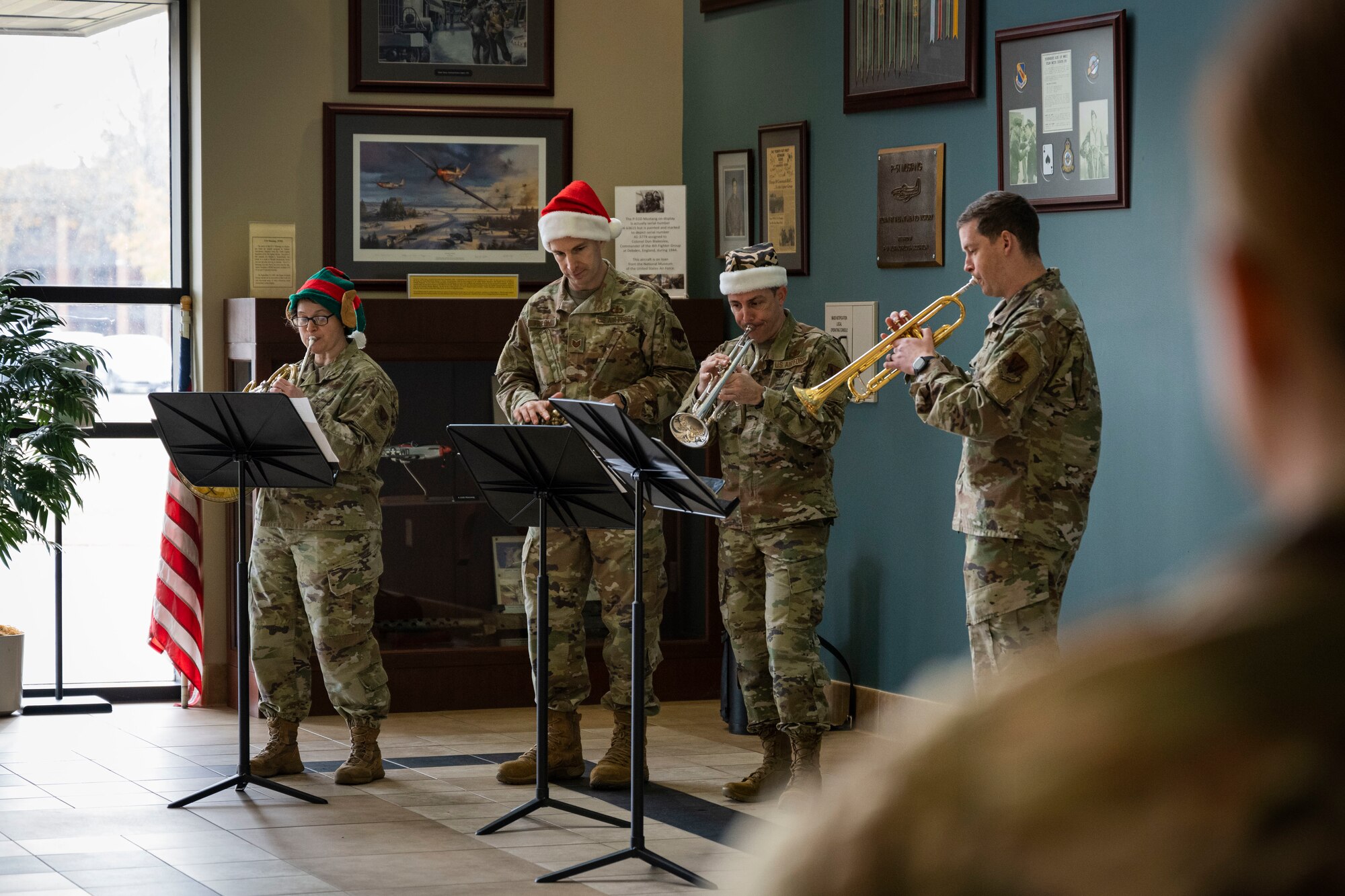 Members of the U.S. Air Force Heritage of America band brass quartet perform at Seymour Johnson Air Force Base, North Carolina, Dec. 14, 2022. Through the universal language of music, the band communicates U.S. Air Force and Department of Defense messages, making lasting connections with their audiences.