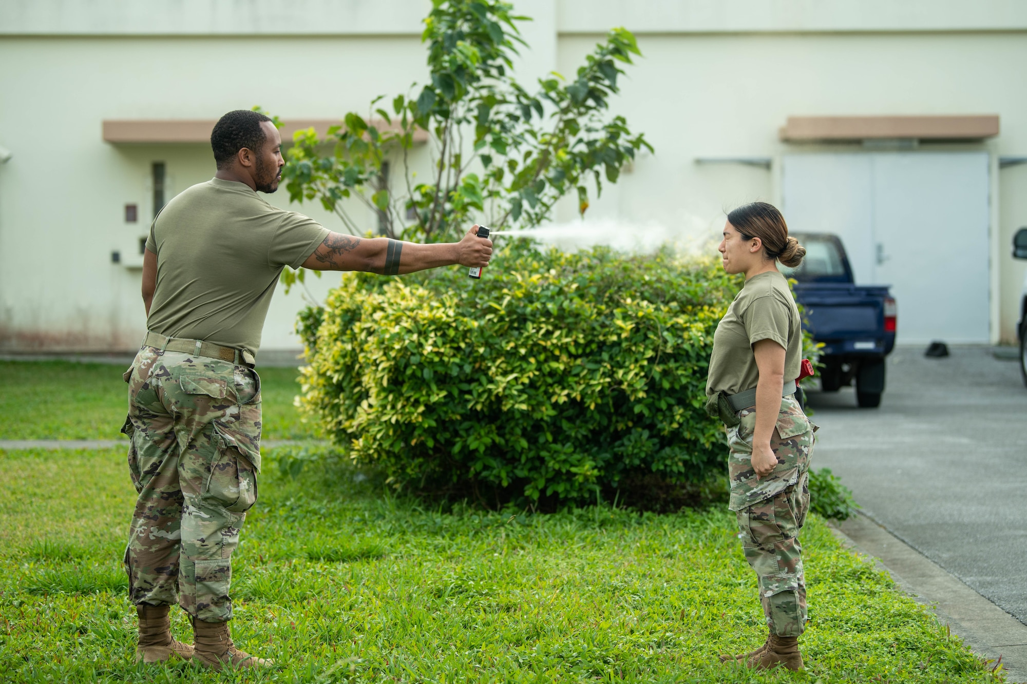 Defender gets sprayed with OC spray during training.