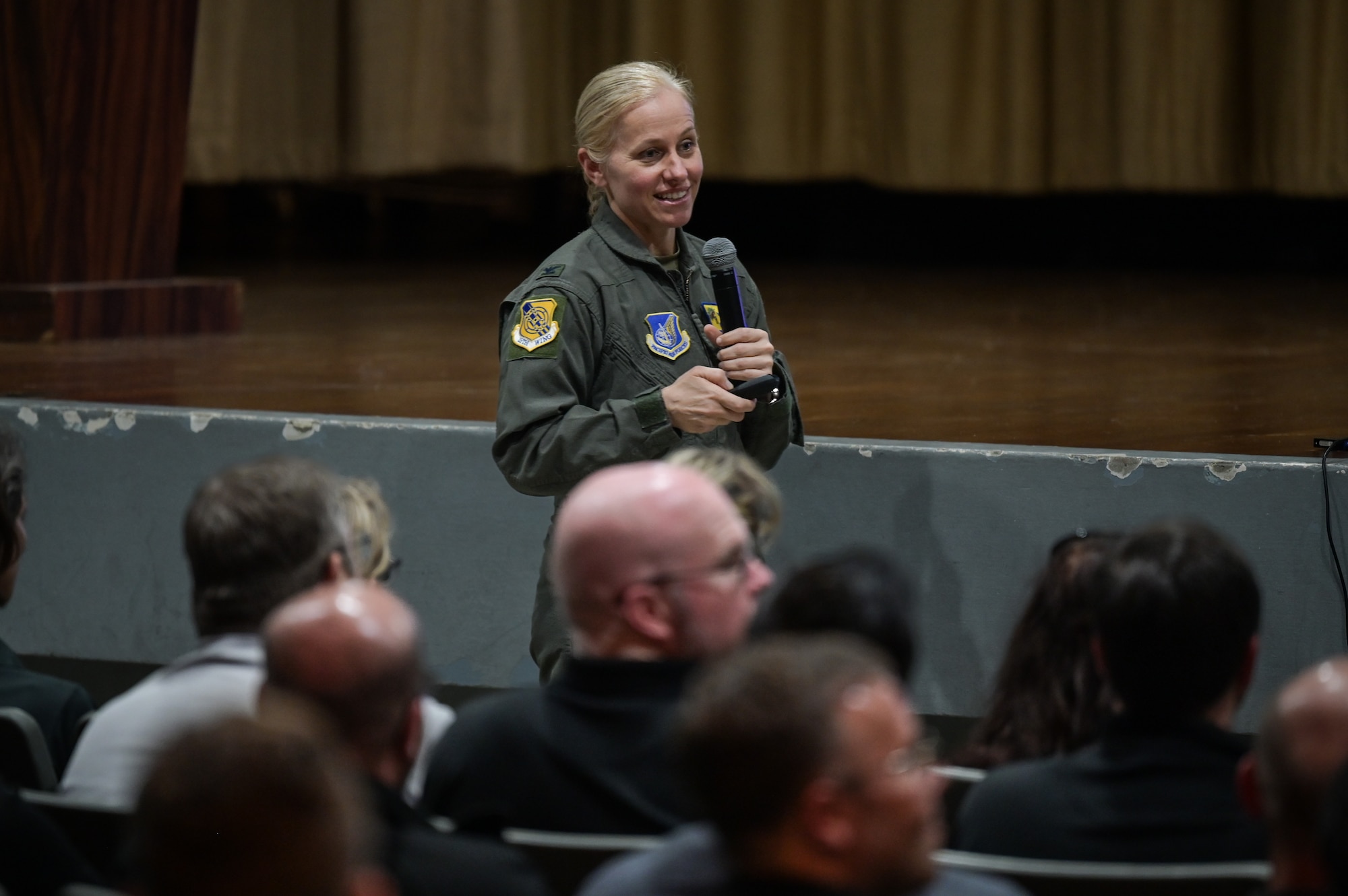 Col. Michelle Lo Bianco, 15th Wing commander, speaks to Executive Leadership Development Program participants during a mission brief in the Hickam Theater at Joint Base Pearl Harbor-Hickam, Hawaii, Dec. 6, 2022. The ELDP is a 10-month program designed to help participants grow their leadership skills by introducing them to senior leaders and service members from various military backgrounds and locations. (U.S. Air Force photo by Staff Sgt. Alan Ricker)