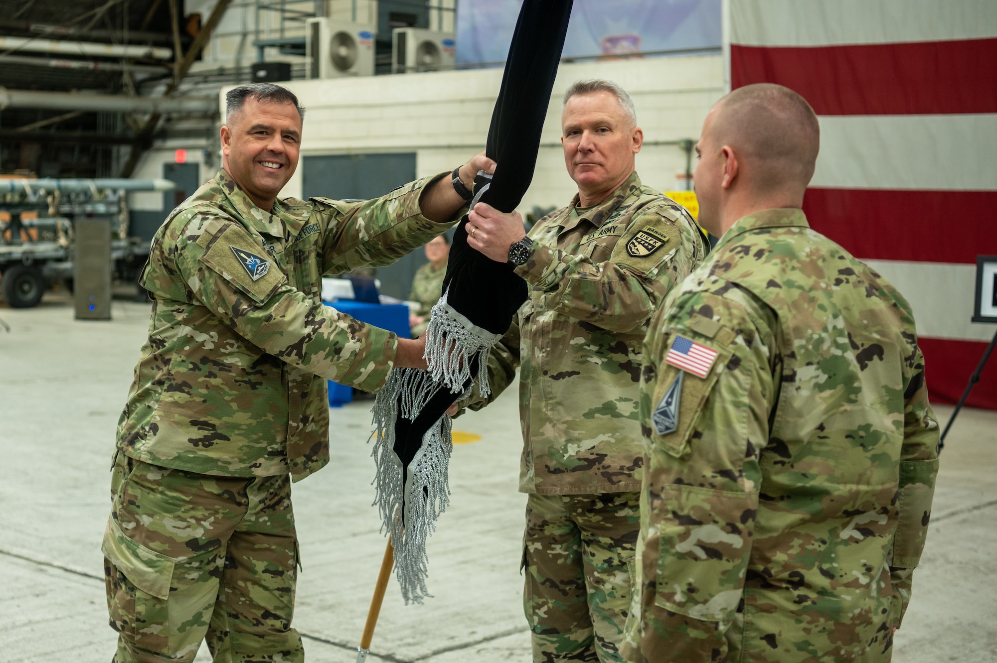 U.S. Space Force Brig. Gen. Anthony Mastalir, U.S. Space Forces Indo-Pacific Command commander, passes the newly activated U.S. Space Forces Korea’s guidon to U.S. Army Gen. Paul LaCamera, U.S. Forces Korea commander, during the unit’s activation ceremony at Osan Air Base, Republic of Korea, Dec. 14, 2022.